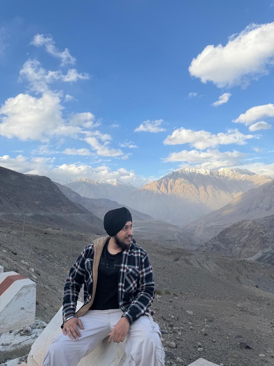 A zerith teammate looking out over snow-capped mountains